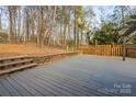 Spacious gray deck with stairs and wooden fence at 69 Honeysuckle Woods, Clover, SC 29710