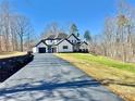 Beautifully constructed home featuring a dark driveway and black trim, set on a spacious green lawn at 177 Olympia Dr, Mooresville, NC 28117