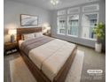 Spacious bedroom with large windows and wood platform bed at 2124 Electric Ln, Charlotte, NC 28205
