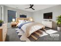 Virtually staged bedroom with light wood furniture and a neutral color scheme at 6848 Good News Dr, Charlotte, NC 28215