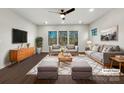 Virtually staged living room featuring a neutral color palette and modern furniture at 6848 Good News Dr, Charlotte, NC 28215
