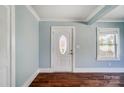 Front entry with wood floors and light blue walls at 804 Rayon St, Charlotte, NC 28216