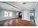 Open living space with hardwood floors and built-in bar at 804 Rayon St, Charlotte, NC 28216