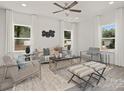 Bright living room with comfy seating, large windows, and a modern coffee table at 906 W Davidson Ave, Gastonia, NC 28052