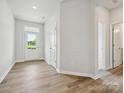 Bright entryway featuring durable wood-look flooring and access to other rooms at 10117 Mamillion Dr, Huntersville, NC 28078