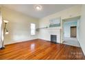 Bright living room featuring hardwood floors and a fireplace at 124 Piedmont St, Rock Hill, SC 29730