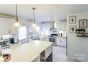 Modern kitchen with white cabinets, granite countertops, and stainless steel appliances at 1866 Baylor Dr, Rock Hill, SC 29732