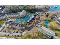 Overhead shot of lakeside condos with a tennis court, boat storage and pond at 18736 Nautical Dr # 201, Cornelius, NC 28031