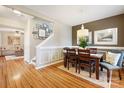 Bright dining room with hardwood floors and a view of the living room at 2012 Orby Ave, Indian Trail, NC 28079