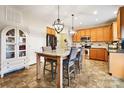 Kitchen with granite island, stainless steel appliances, and wood cabinets at 2012 Orby Ave, Indian Trail, NC 28079