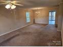 Spacious living room with carpet flooring and a ceiling fan at 240 Pointe Cir # 240, Rock Hill, SC 29732