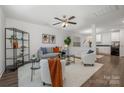 Open living room with modern furniture and kitchen view at 275 Broad Sw Dr, Concord, NC 28025