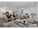 Open living space with modern furniture and kitchen island view at 3016 Ora Smith Rd, Lincolnton, NC 28092