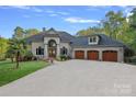 Stunning brick home with a three-car garage and manicured lawn at 3917 Acacia N Rd, York, SC 29745