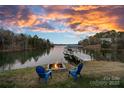 Relaxing lakefront view with firepit and chairs at 3917 Acacia N Rd, York, SC 29745