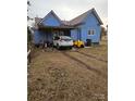 House with carport and a partially visible yard at 414 S Yadkin Ave, Spencer, NC 28159