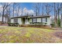 Green ranch house with a small front porch at 4452 Huntington Dr, Gastonia, NC 28056