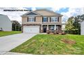 Two story house with stone accents and a landscaped lawn at 453 Court House Ave, York, SC 29745