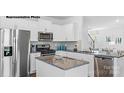 Modern kitchen with white cabinets and granite island at 453 Court House Ave, York, SC 29745