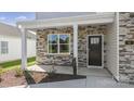 Two-story house with stone accents and a covered porch at 4618 Harris Elliot Rd, Lincolnton, NC 28092