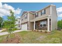 Charming two-story home with stone accents, a two-car garage, and a well-manicured lawn at 4618 Harris Elliot Rd, Lincolnton, NC 28092