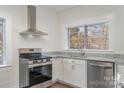 Modern kitchen with stainless steel appliances and granite countertops at 520 Waddell Dr, Albemarle, NC 28001