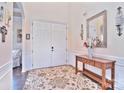 Bright entryway with double doors and wood console table at 5600 Ballenger Ct, Waxhaw, NC 28173