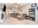 Spacious living room with fireplace and L-shaped sofa at 844 Turning Point Ln, Concord, NC 28027