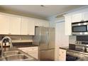 Modern kitchen with stainless steel appliances and white cabinets at 9041 J M Keynes Dr # 10, Charlotte, NC 28262