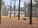 Spacious backyard with mature trees and a partly cleared area at 1194 Great Falls Hwy, Chester, SC 29706