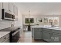 Modern kitchen with stainless steel appliances and an island at 13311 Arbor Meadows Ct, Charlotte, NC 28269