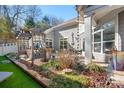 Outdoor patio with seating area, grill, and artificial turf at 19411 Greentree Way, Cornelius, NC 28031