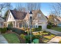 House exterior with landscaping, lamp post, and driveway at 19411 Greentree Way, Cornelius, NC 28031