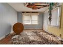 Bedroom in need of repair, with damaged ceiling, debris, and wood floors at 2021 Willis Dr, Shelby, NC 28152
