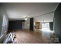 Spacious living room with hardwood floors and open kitchen view at 210 Barbary Dr, Statesville, NC 28677