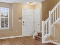 Bright entryway with staircase and wood flooring at 3102 Windsor Trace Dr, Fort Mill, SC 29707