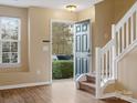 Entryway with staircase, wood floors, and neutral walls at 3102 Windsor Trace Dr, Fort Mill, SC 29707
