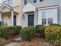 Gray townhome exterior with dark door and shrubs at 3102 Windsor Trace Dr, Fort Mill, SC 29707