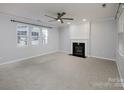 Living room with fireplace and ceiling fan at 5726 Cactus Valley Rd # 238, Charlotte, NC 28277