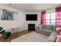 Comfortable living room featuring a fireplace and a large television at 9142 Mackinaw Dr, Gastonia, NC 28056