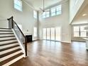 Spacious living room with hardwood floors, fireplace, and sliding glass doors at 9811 Ardley Park Way # 30, Mint Hill, NC 28227