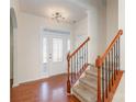 Entryway with hardwood floors, staircase, and a white door at 10422 Ebbets Rd, Charlotte, NC 28273