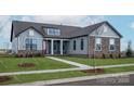 Attractive single-story home with stone details, manicured lawn, and inviting red front door at 1846 Yardley St, Rock Hill, SC 29732