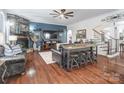 Cozy living room featuring hardwood floors, fireplace, and built-in shelving at 217 Ridge Reserve Dr, Lake Wylie, SC 29710