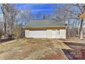 Spacious detached garage featuring a single garage door and neutral colors at 2205 E Brief Rd, Monroe, NC 28110