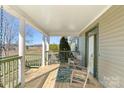 Relaxing front porch with rocking chairs and a view of the countryside at 261 Nabors Rd, Statesville, NC 28677