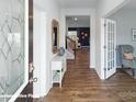 Bright entryway with hardwood floors and a view into the living area at 3929 Coleman Dr, Charlotte, NC 28215