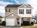 Two-story house with beige siding and a white accent at 4529 Esmeralda Dr, Charlotte, NC 28269