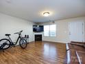 Spacious living room with hardwood floors and a fireplace at 4529 Esmeralda Dr, Charlotte, NC 28269