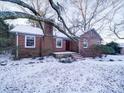 Brick ranch house with a snow covered lawn at 48374 Pfeiffer Pl, Misenheimer, NC 28109